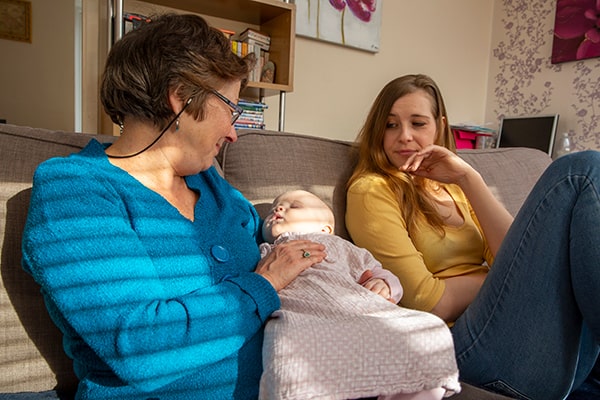 Home-Start volunteer with mum and baby